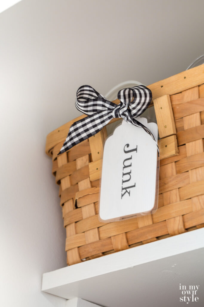 Junk label on basket in newly painted closet