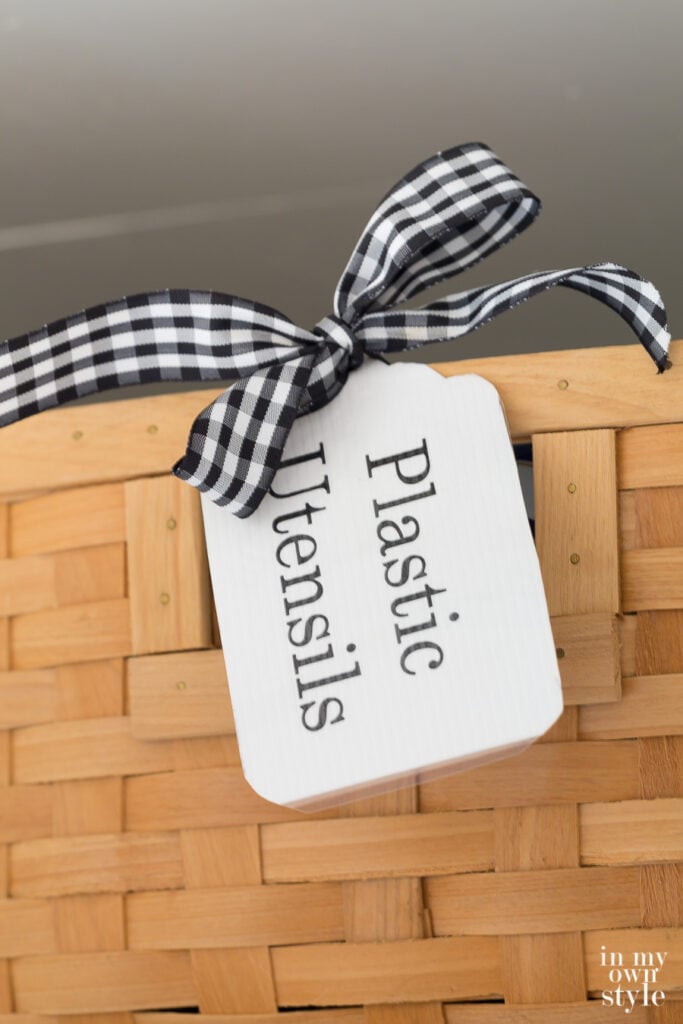 Plastic Utensil label on a basket in party closet