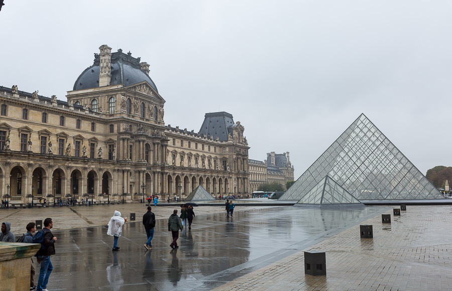 the Louvre Pyramid on a rainy day