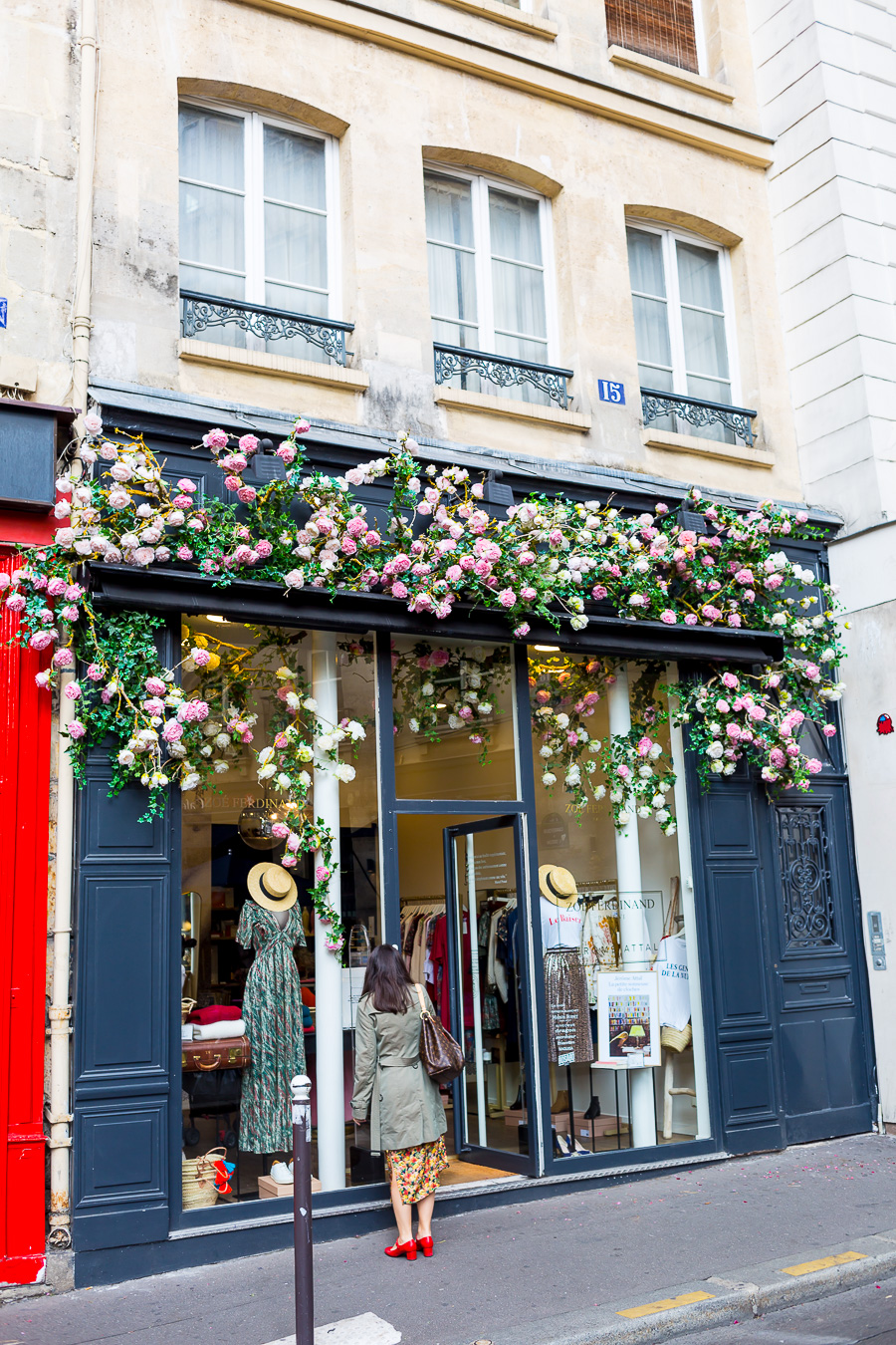 Pretty shop on St Germain Paris with flowers over the top of the entrance