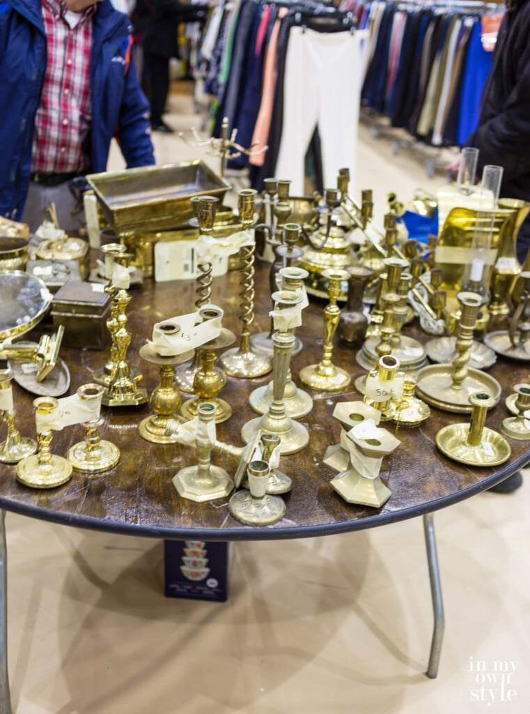 Brass candlesticks on a sales table at holiday bazaar
