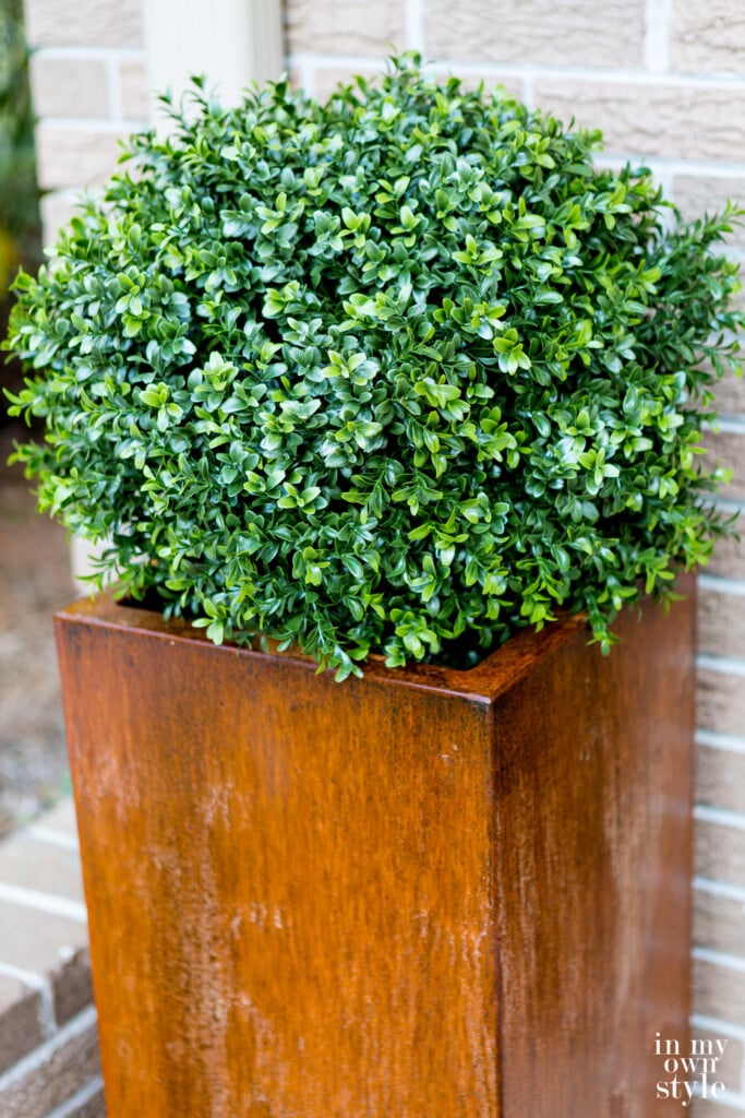 Veradek Metal planter being aged to a rusted patina.