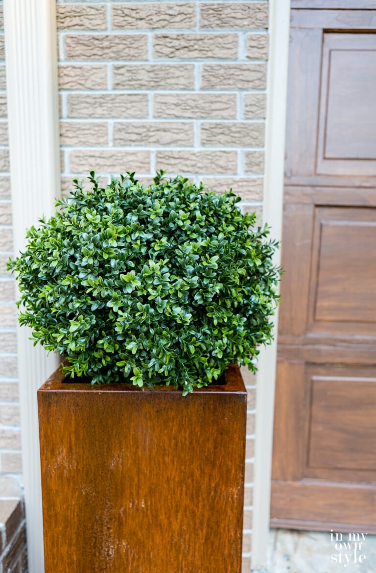 Fake boxwood globe in Veradek Corten steel planter.