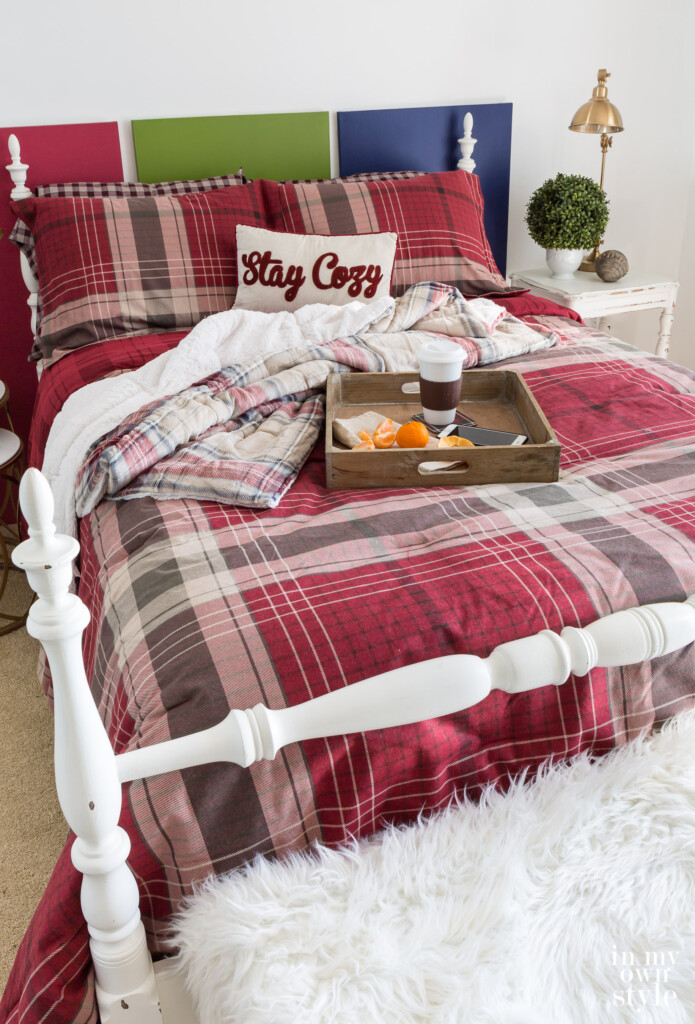 CuddlDuds Red plaid comforter and shams on a bed.