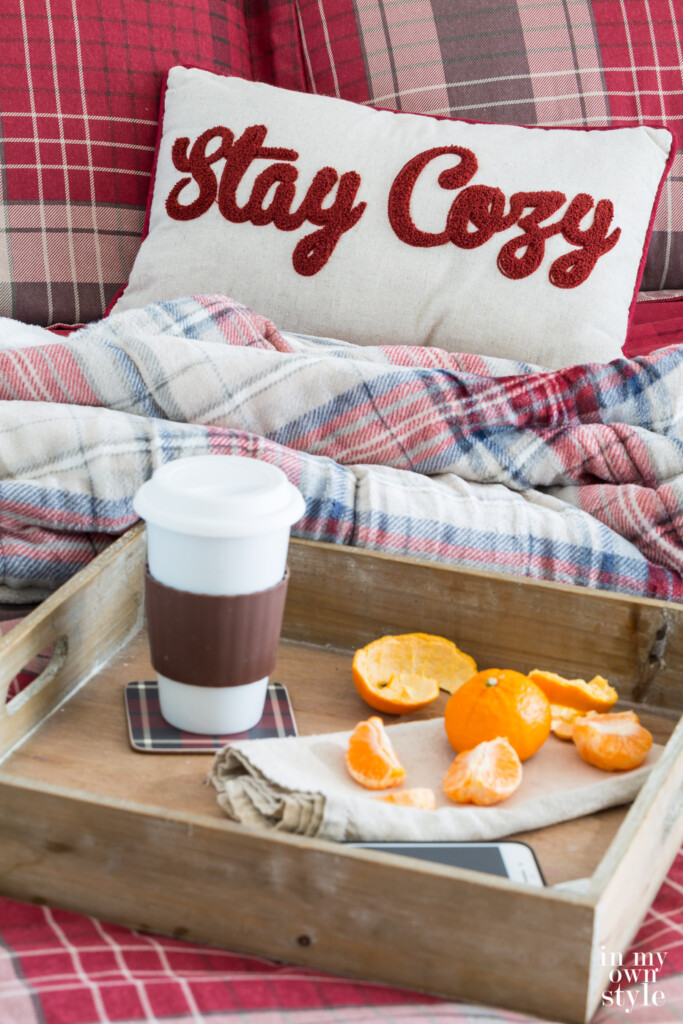 Stay Cozy pillow on guest room bed
