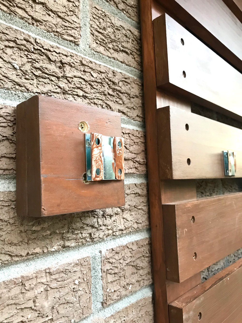 When attaching plate to wall and slats add blocks on one side.