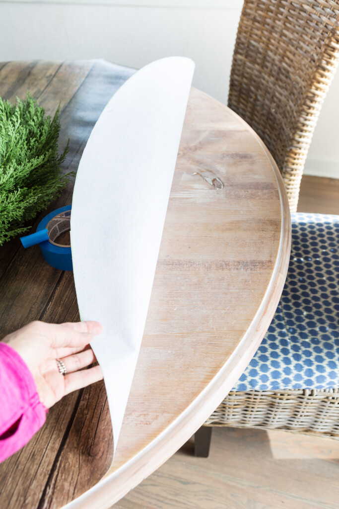 creative table cloth idea showing the before and after of the budget friendly table cloth alternative