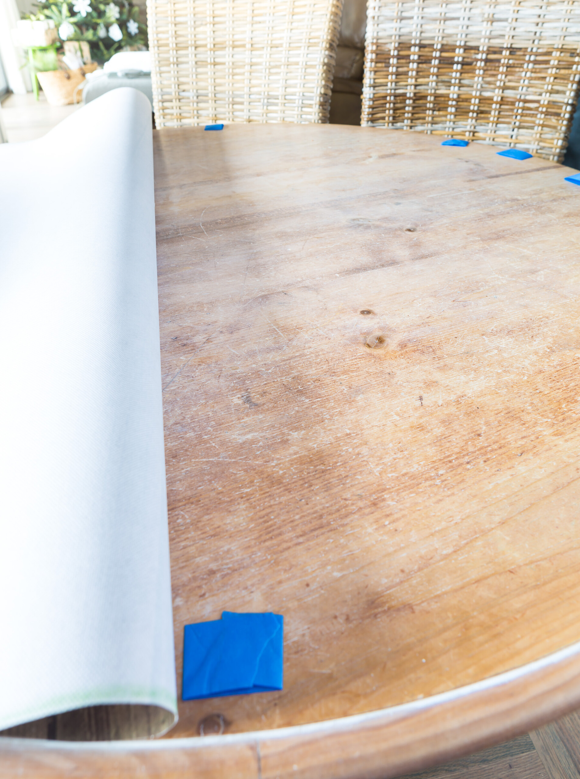 How to attach bulletin board roll to a dining table as a creative alternative to a cloth table cloth.