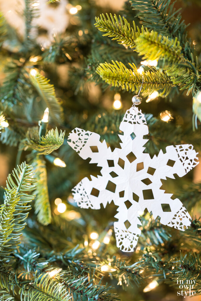 Paper doily made into a snowflake Christmas tree ornament