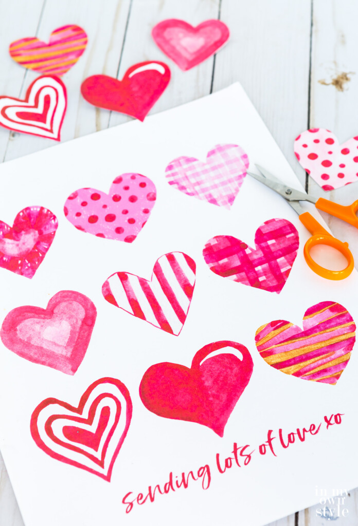 Free printable sheet of watercolor hearts to use for Valentine cards and crafts.