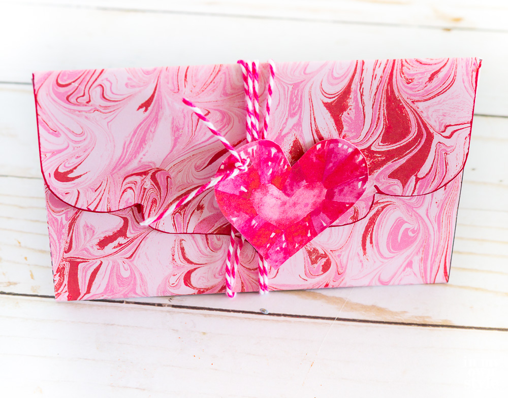 How to use scrapbook paper to make a Valentine envelope.