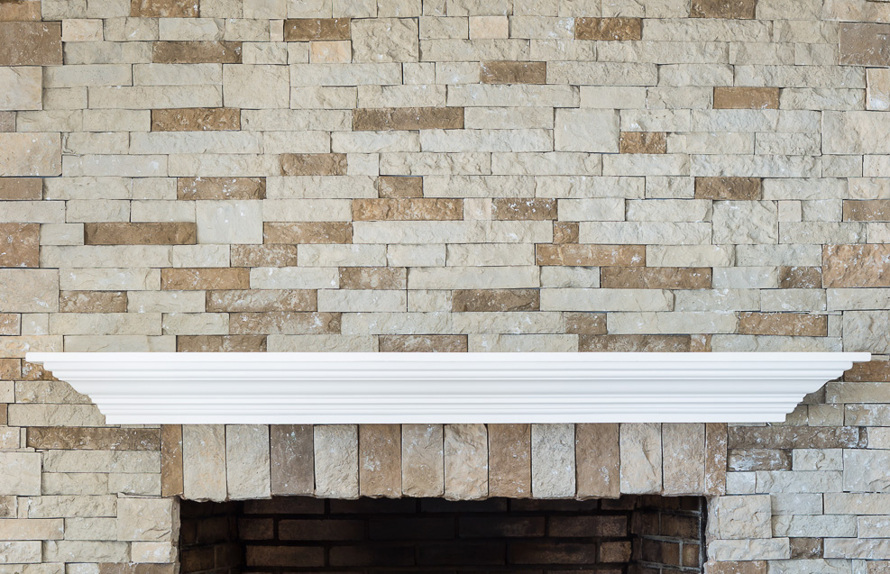 Empty fireplace mantel waiting to be decorated.