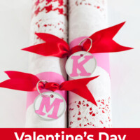 Two cardboard tubes creatively wrapped for Valentine's Day giving.