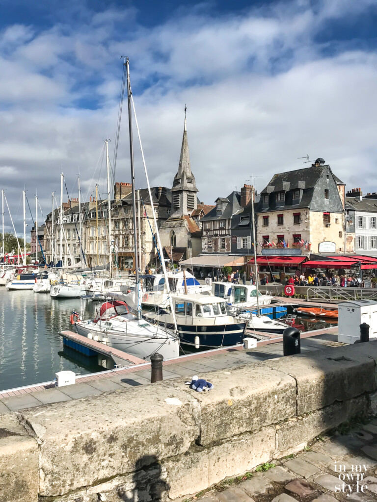 Honfleur Harbor with boats, shops and restaurants.