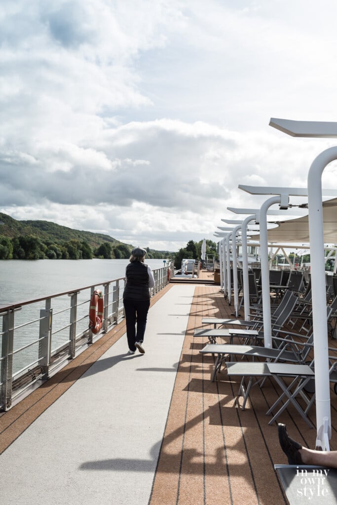 Walking along the top of a Viking River Cruise Longship on the Seine in France.