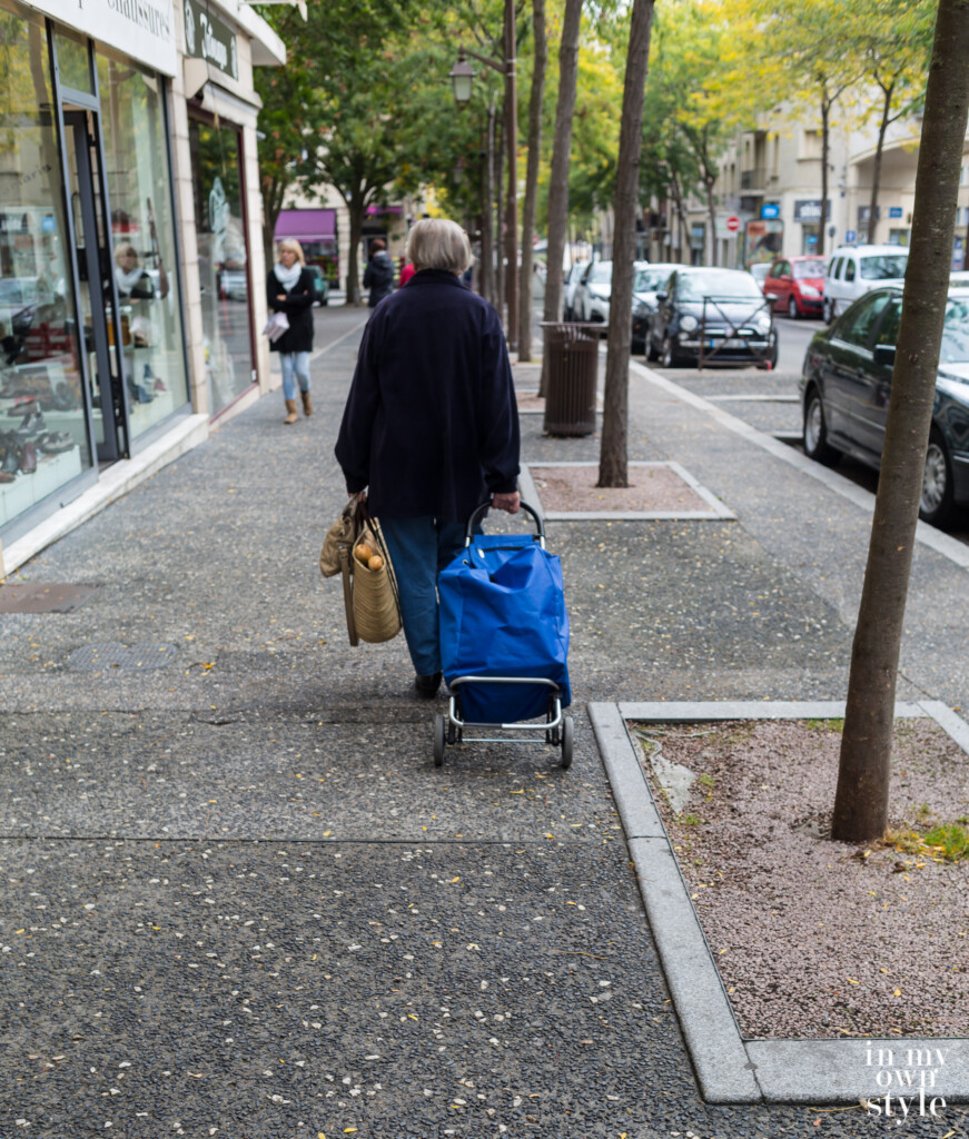 Shopping with a pull cart in France.