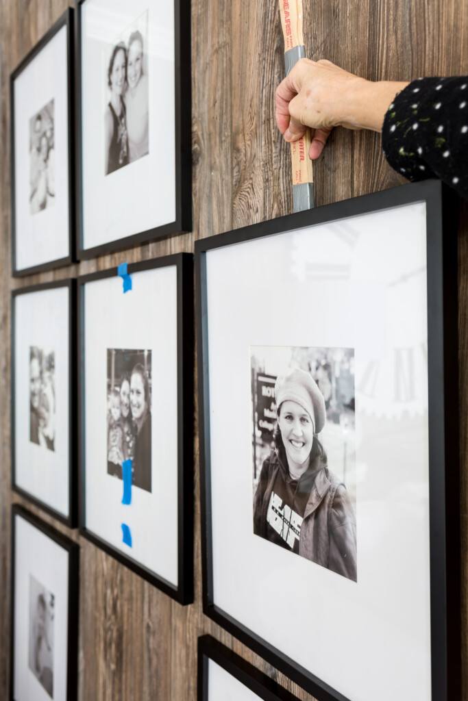 How to hang a photo on a wall without making more than one hole in the wall.