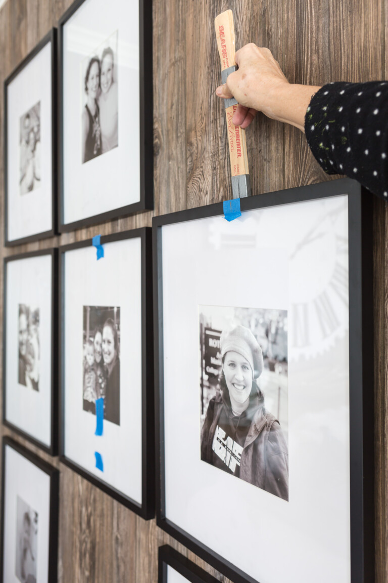 Framed artwork hanging tool that makes hanging art or framed photos level on a wall.
