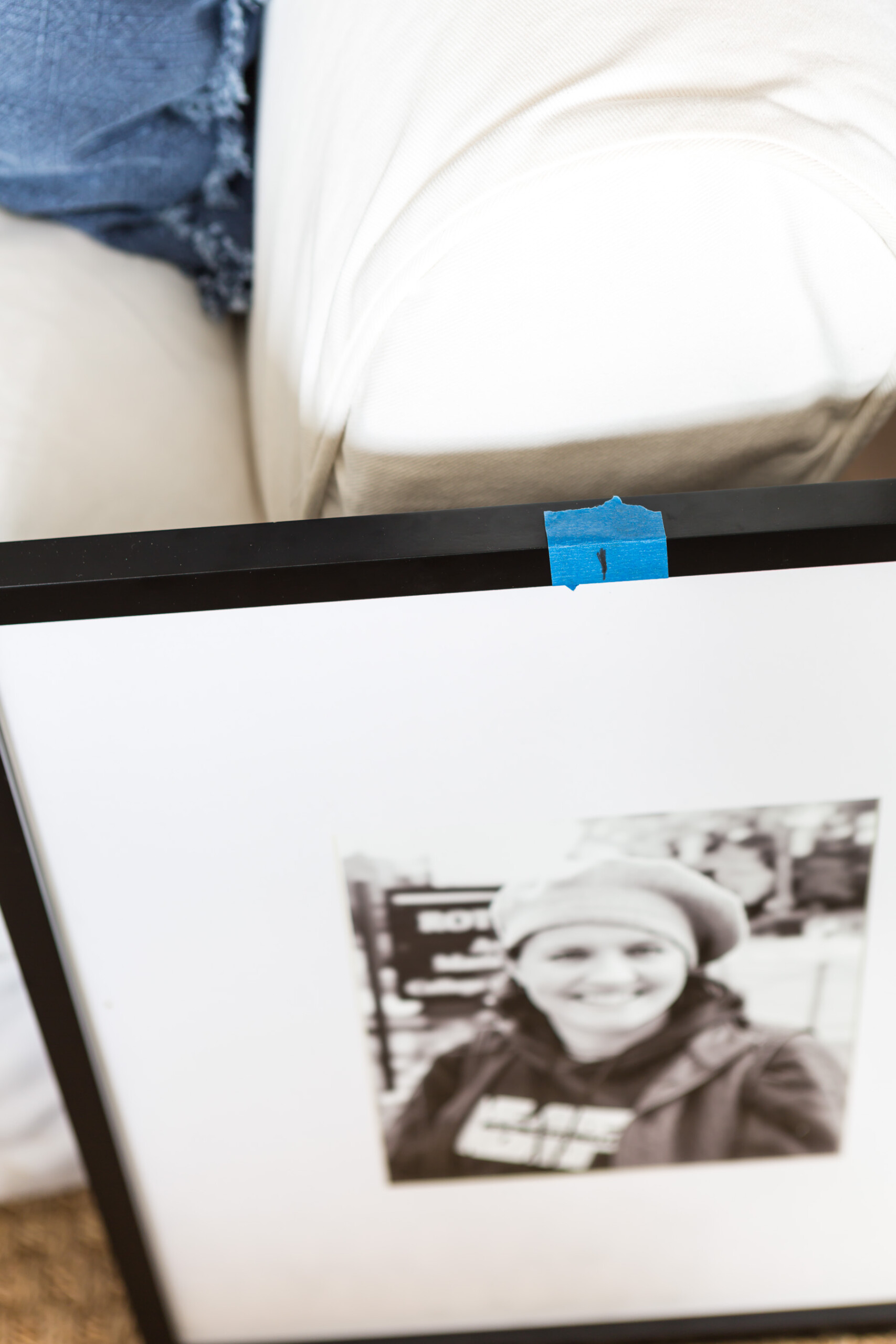 Measuring the frames to fit evenly for a grid style gallery wall.