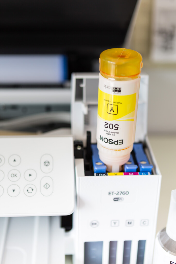 Epson Photo printer being filled with ink.