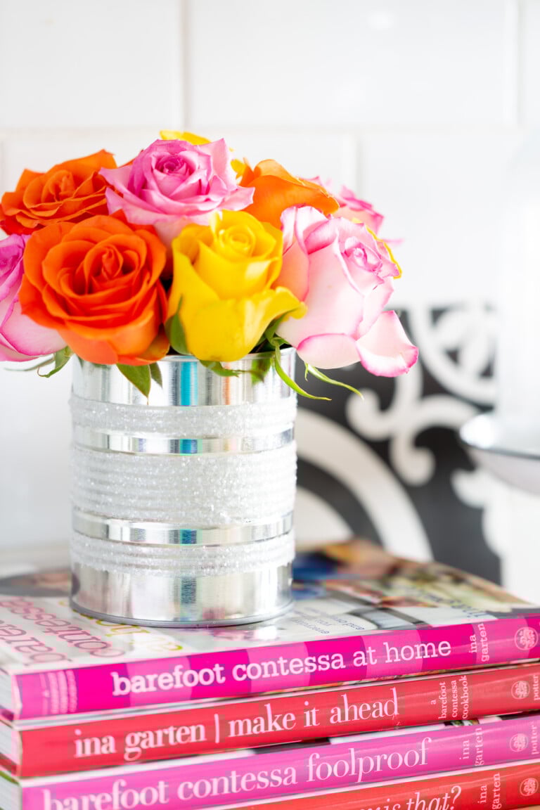 Kitchen counter styling ideas. Rainbow roses styled in a diy tin can vase on a kitchen counter.