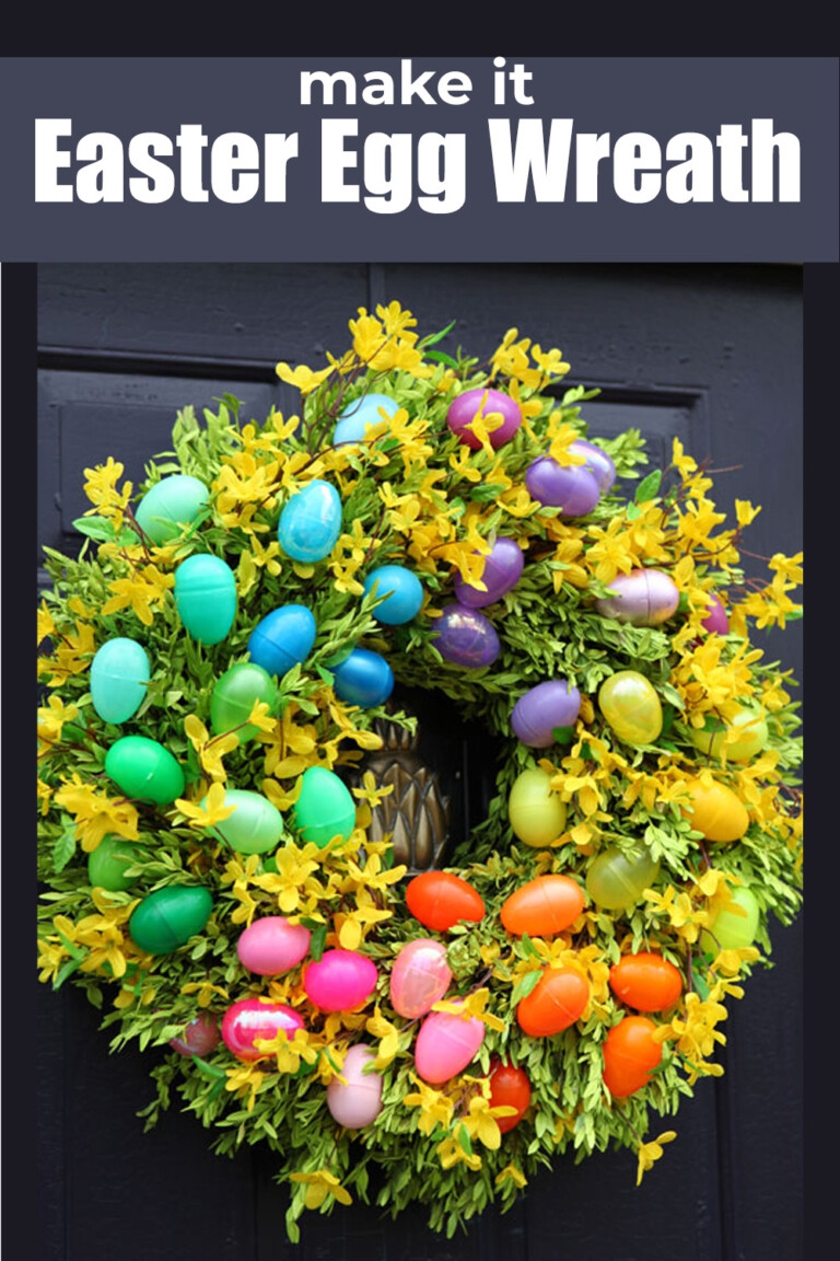Colorful plastic Easter Egg wreath on black door.