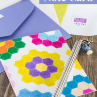 Free printable note card of a colorful quilt block design of grandmother's garden.