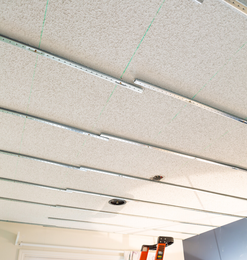 Popcorn ceiling cover up ideas DIY using the Armstrong Easy Up tracks, clips and planks.