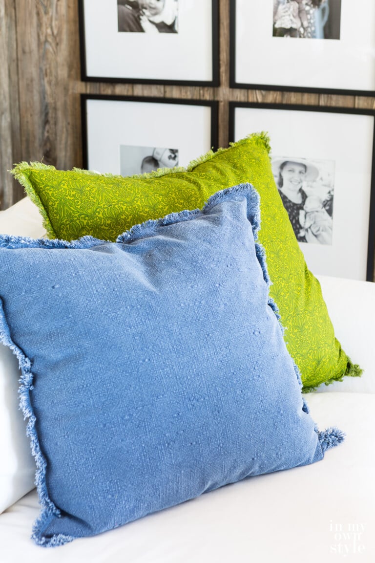 two pillows on sofa. One lime green, the other blue