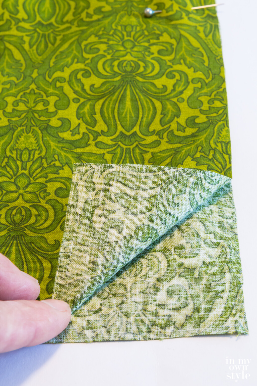 Lay pillow cover fabric wrong sides together.
