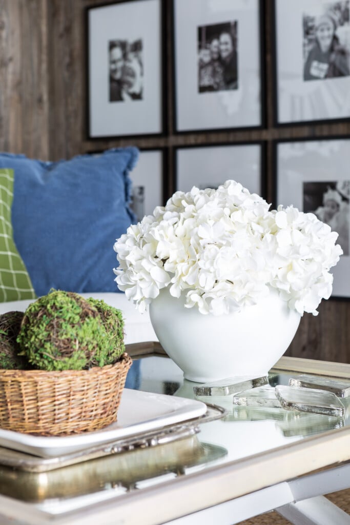 White spray painted planter on table.