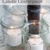 Recycled and repurposed glass jelly jar umbrella table candle centerpiece.