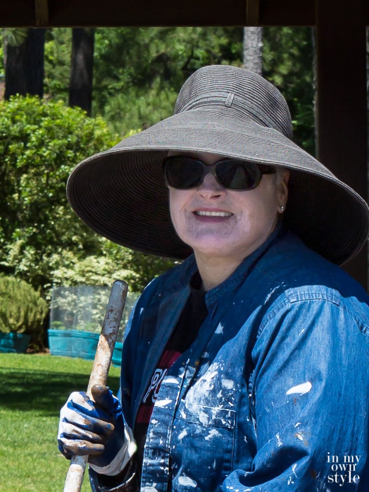 Closeup photo of Blogger In My Own Style wearing a large brim black hat to protect her Vitiligo from the sun.