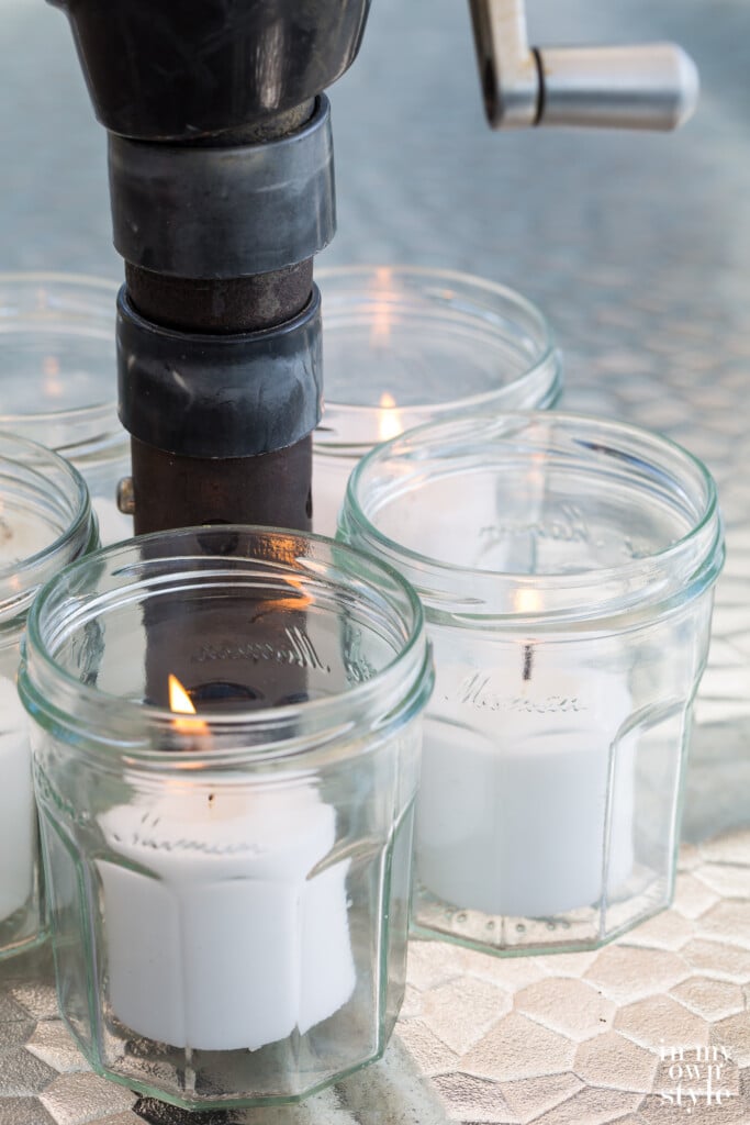 Close up of lit jelly jars Candle Centerpiece for Patio Umbrella Table