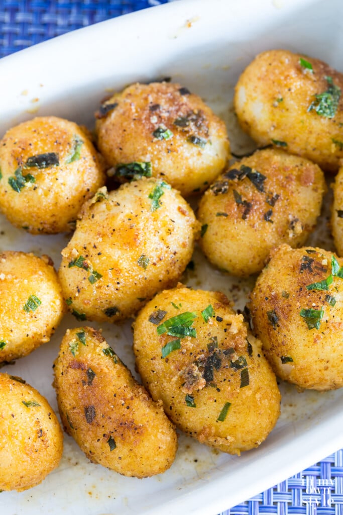 Gourmet herbed canned potatoes in a white serving dish.