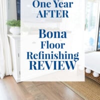 Living room with grey refinished floor. Text overlay on photo says One Year After Bona Floor Refinishing Review