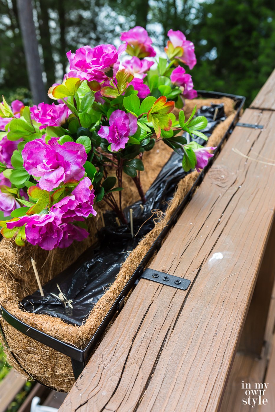 How do you anchor fake plants and flowers in a window box planter? Styrofoam.