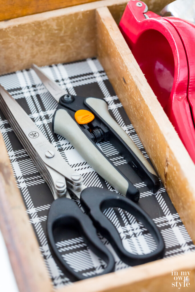 Herb snips and Herb chopping scissors in an open kitchen drawer.