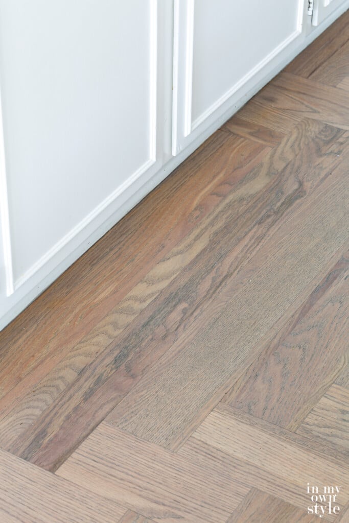Bona Flooring Grey Stained floor in kitchen.