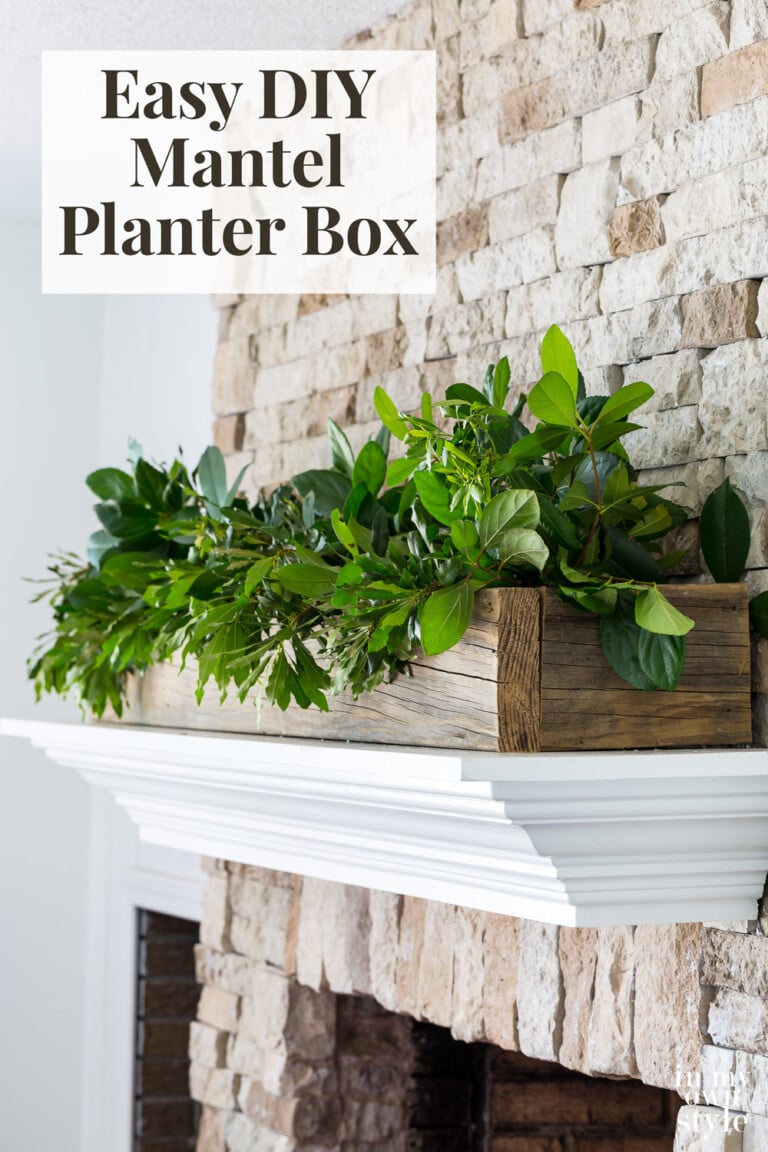 Stone fireplace with white mantel. Wood planter box filled with greenery on top. Text overlay says Easy DIY mantel planter box.