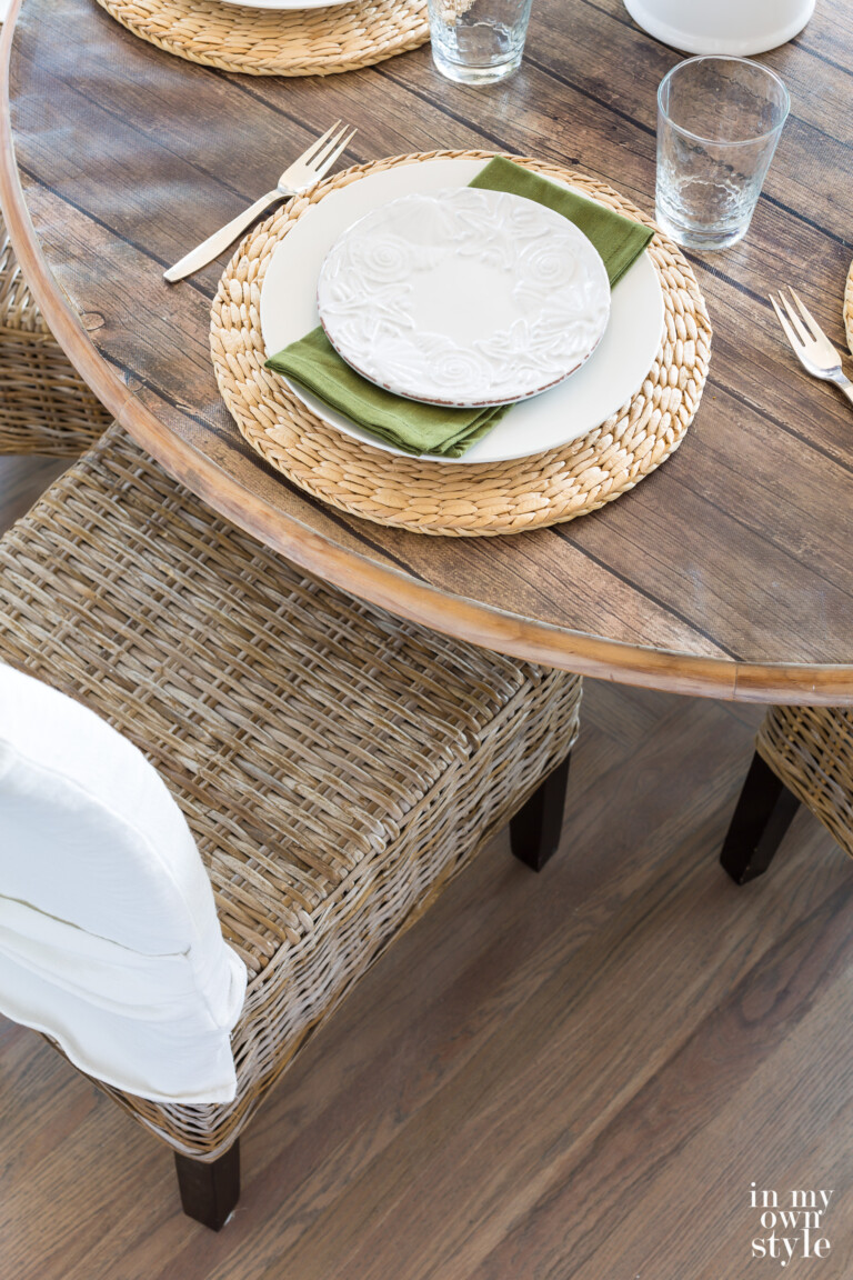 Birds eye view of kitchen table setting done in driftwood grey, white and green.