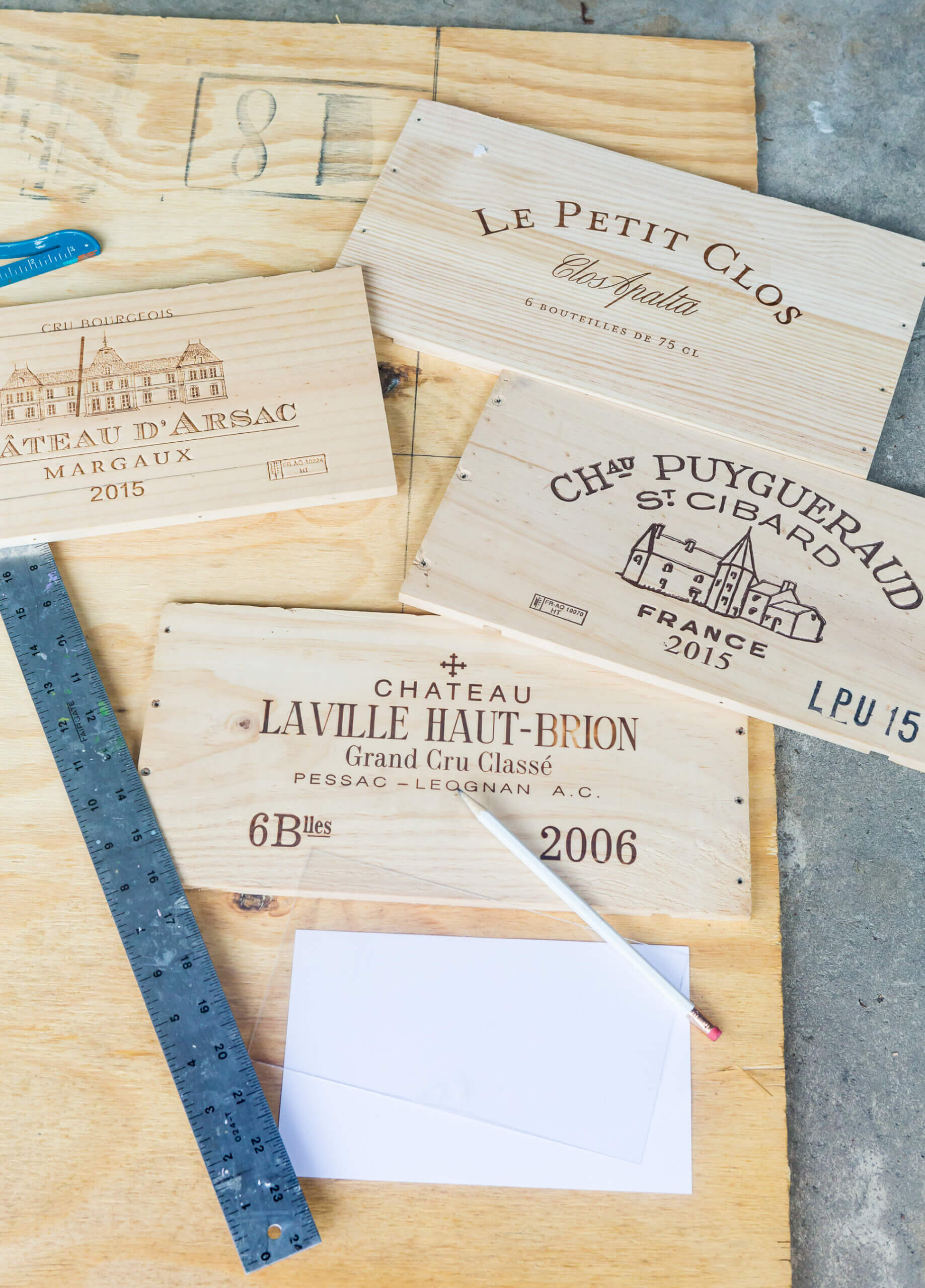 Plywood and wine crate fronts getting ready to be cut to make a custom recipe card box.