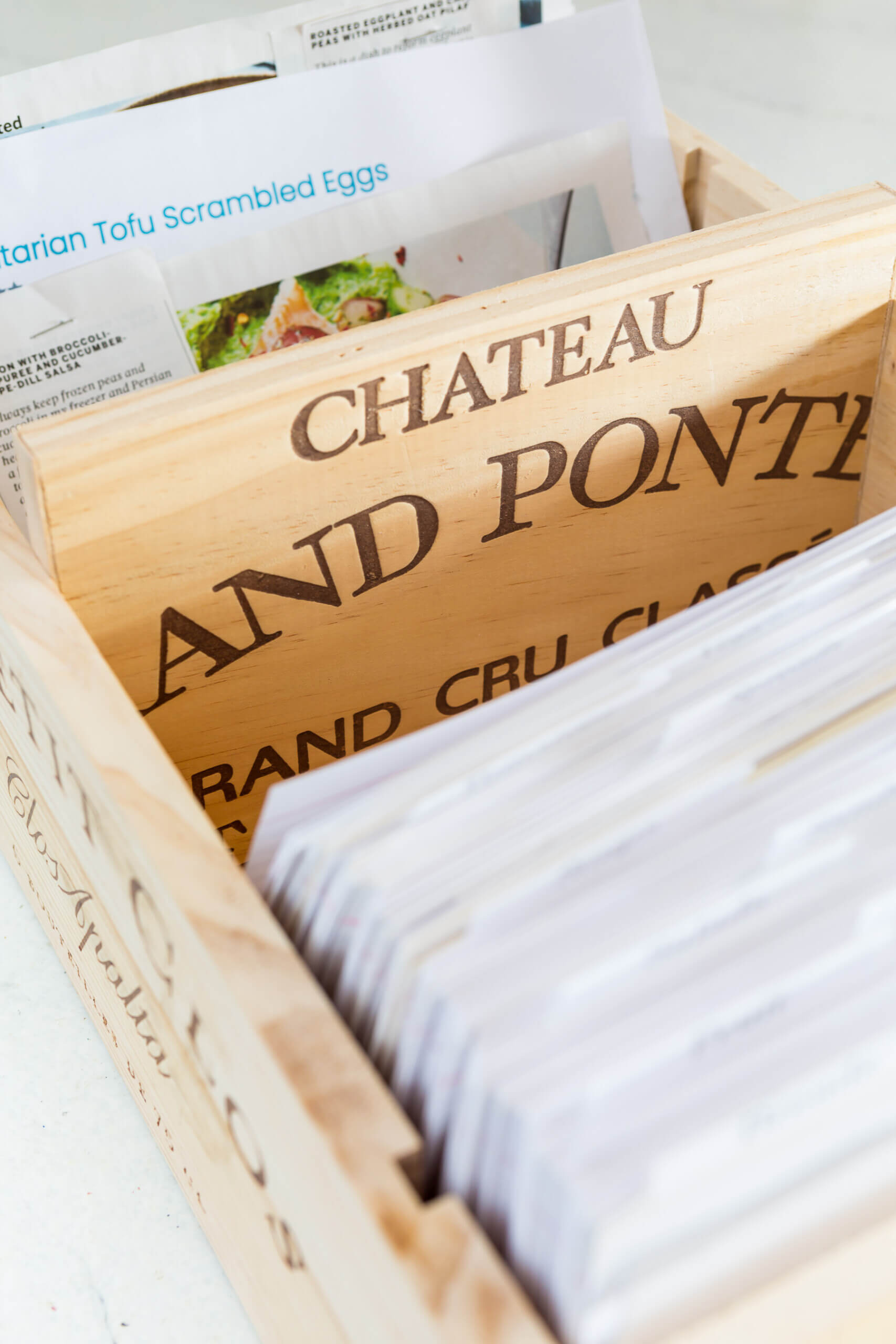 Wood wine crate front used to make a divider in a recipe card holder box.