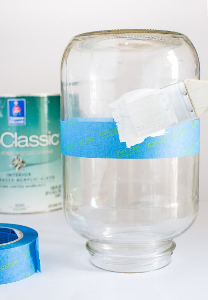 How to paint a large glass pickle jar to make a vase to use to decorate a home.