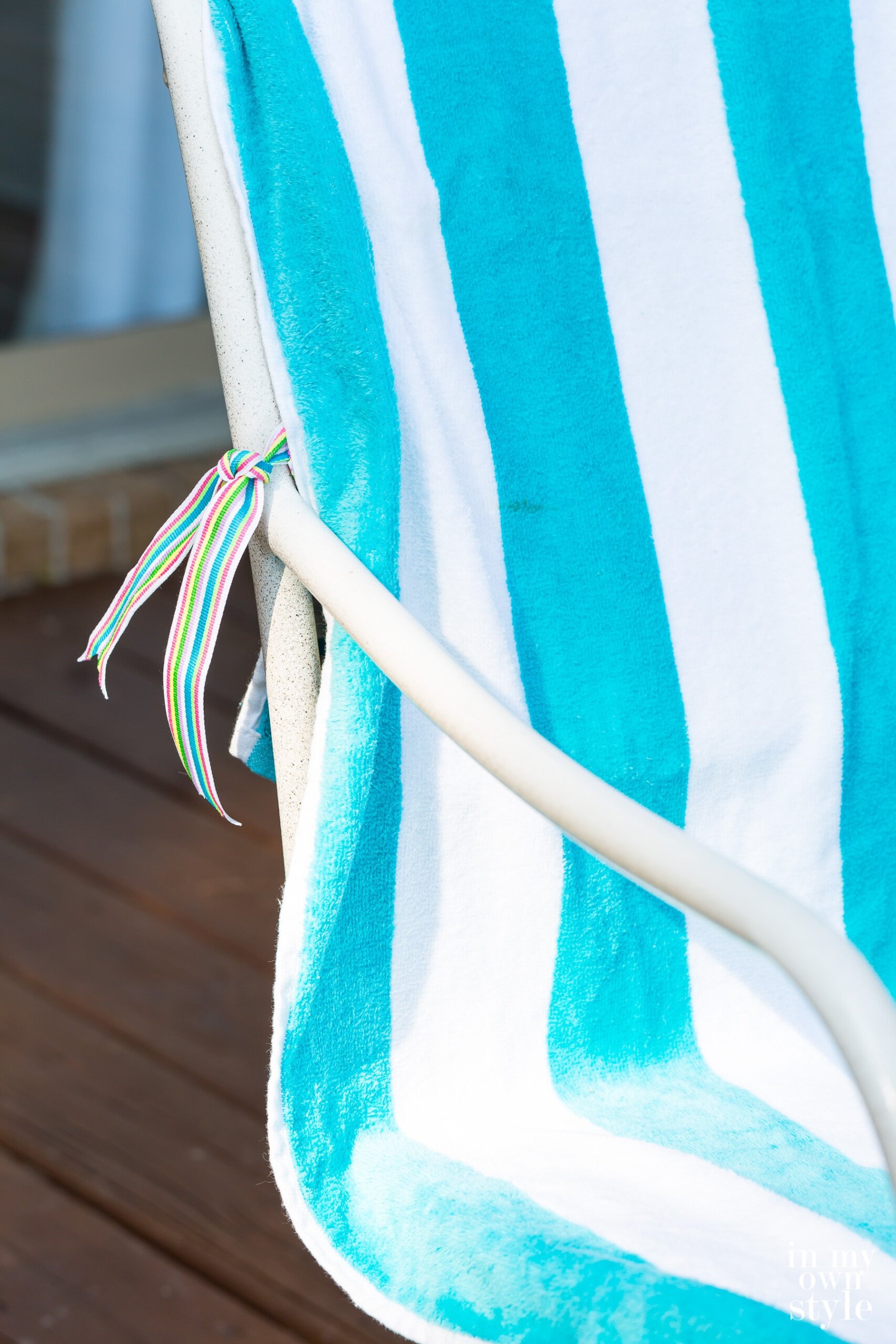 Tie on beach towel outdoor chair cover DIY.