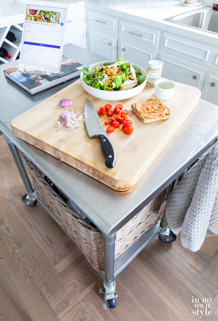 My rolling metal kitchen cart got a makeover. Now it has two shelves and a cutting board.