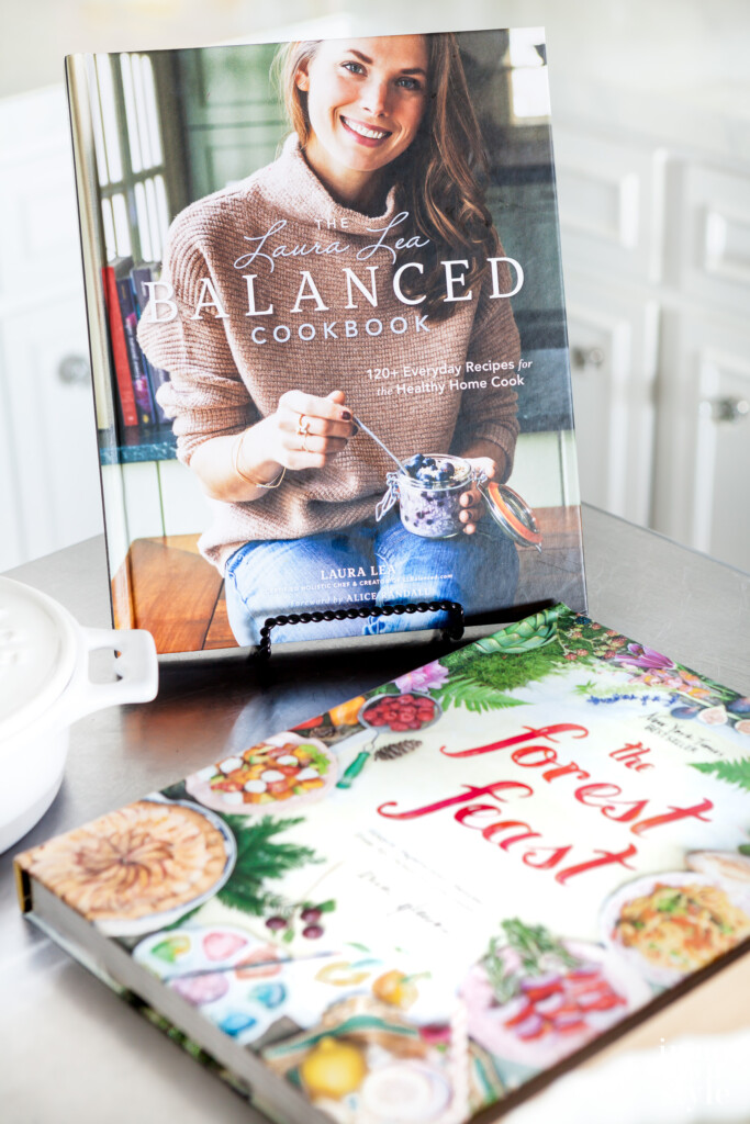 LL Balanced and The Forest Feast Cookbooks on kitchen island.