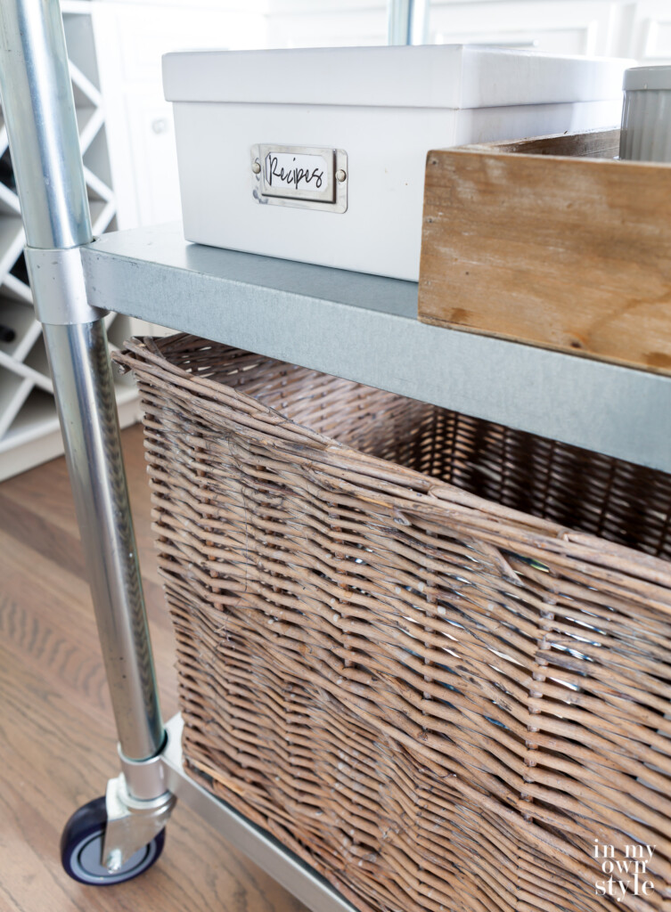Close up of second shelf added to rolling metal kitchen cart that acts like an center kitchen island.