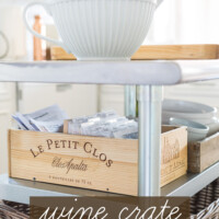 Kitchen island with recipe box on it. Text overlay says Make It! Wine crate recipe card box.