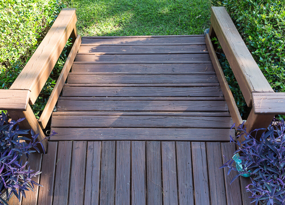 Looking down on deck staircase stained in the color Behr Chocolate.